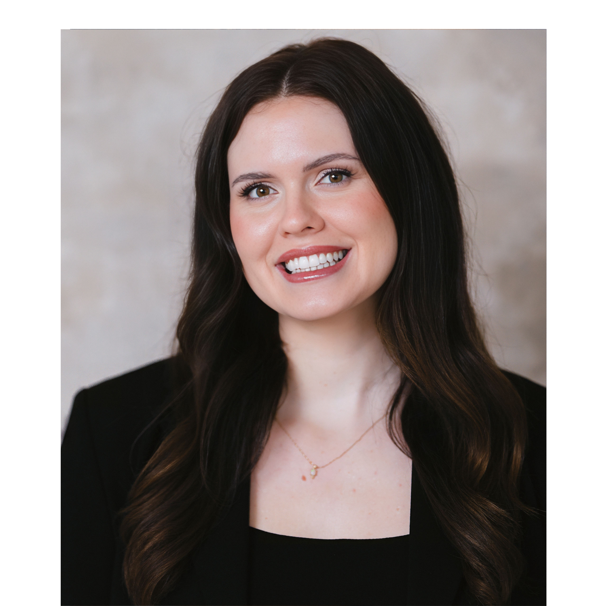 Woman with long dark hair smiling against a neutral background