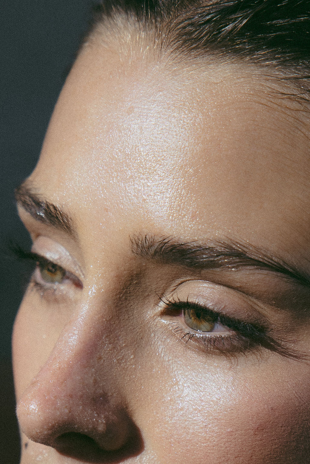 Close-up of a person's face (forehead, eyes, notes)