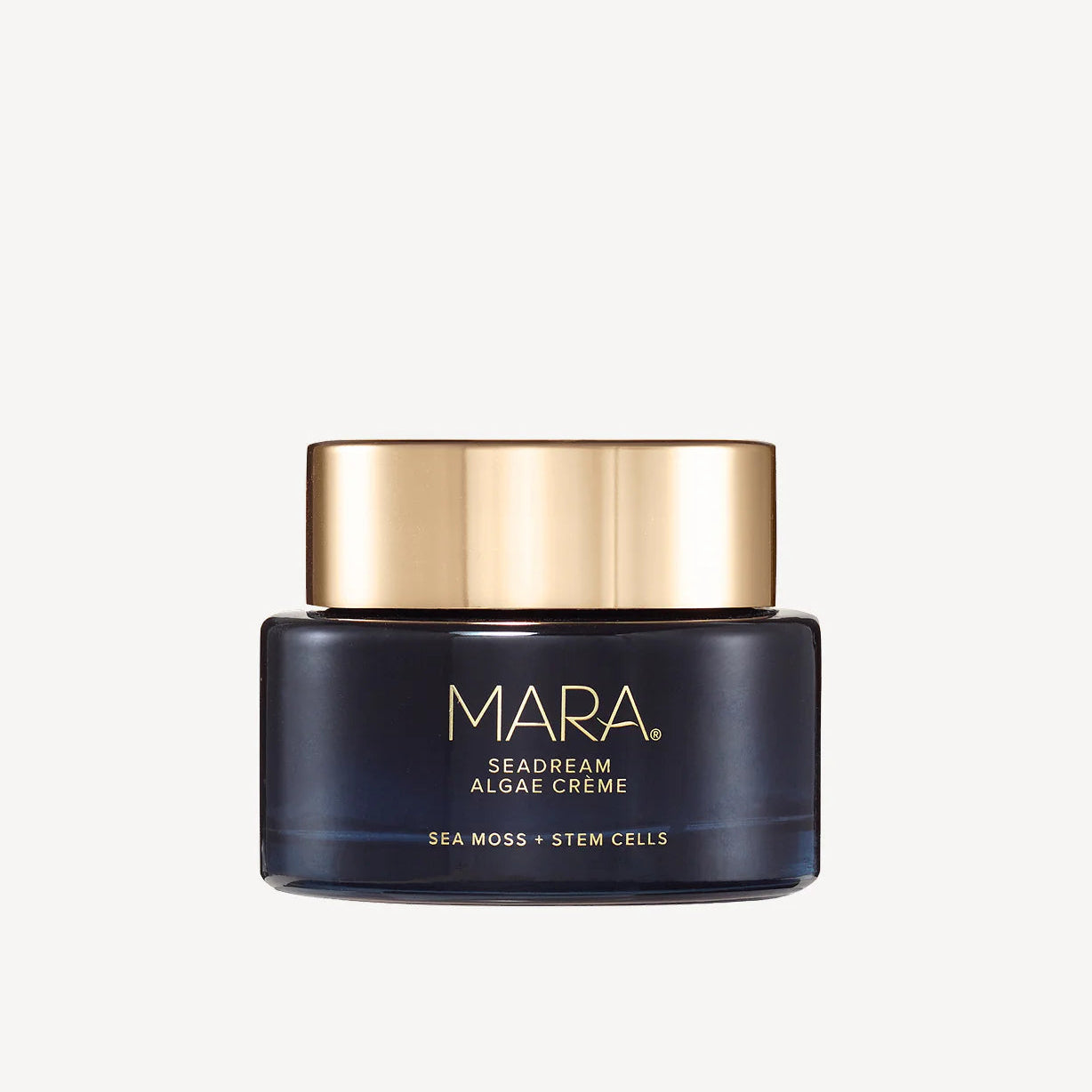Cosmetic jar with gold lid and black body on a white background